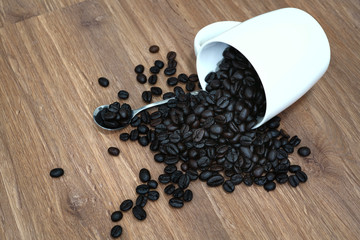Coffee Bean in Cup on the Wooden floor