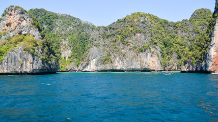 Obraz premium The island of Phi Phi.Island view from a boat on the sea background.Thailand