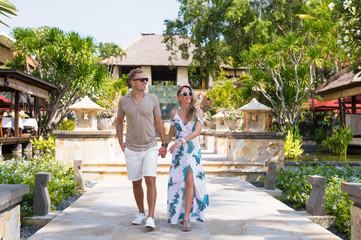 Romantic couple walking in tropical resort