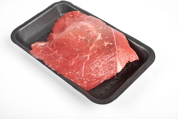 fresh raw beef in a package isolated on white background