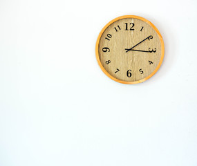 Wood clock on white wall