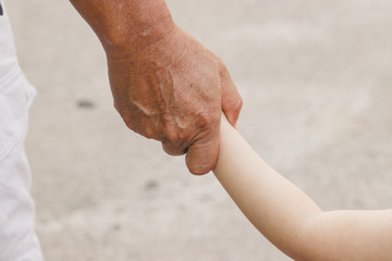 Hands of Fater and baby.