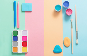 school supplies at  colorful paper background texture