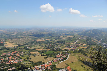Fototapeta na wymiar Typical sunny summer landscape of rural northern Italy from height of bird's flight.