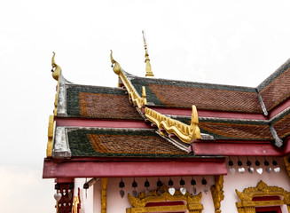 fragment of multi colored tiled roof in the sunligh