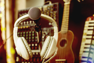 Microphone in room with recording device.