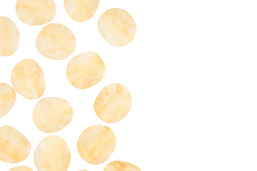 Fototapeta na wymiar Golden potatoes chips flying on white background, isolated, copy space. Fast food backdrop, top view.
