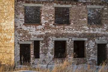 Fototapeta na wymiar The old abandoned unfinished brick building close-up.