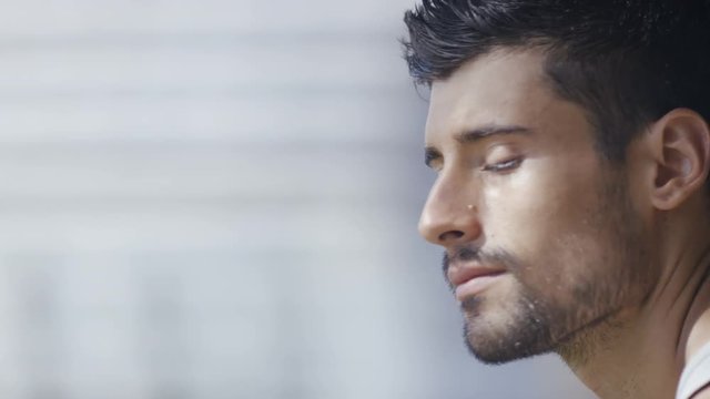 Portrait of handsome hispanic male looking to camera and smiling 