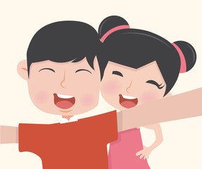 boy and girl taking a selfie photo