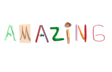 The word amazing created from office stationery.