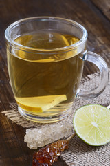 Tea mug with lemon and sugar sticks