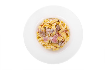 Pasta, noodles with bacon and mushrooms, decorated with cheese. view from above. Serving a meal in a cafe, restaurant. Isolated white