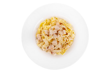 Pasta, noodles with chicken, decorated with cheese. Isolated white view from above Serving a meal in a cafe, restaurant.
