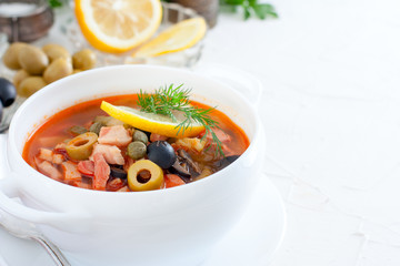 Traditional Russian soup Solyanka in Moscow, horizontal, copy space