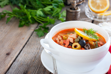 Traditional Russian soup Solyanka in Moscow, horizontal, copy space