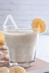 Banana chilled smoothies with banana, milk, almonds and honey, selective focus