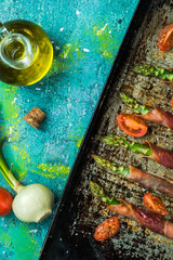 Obraz na płótnie Canvas Grilled asparagus with prosciutto ham