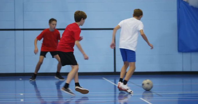 4k Young soccer players celebrate after scoring a goal. Shot in slow motion