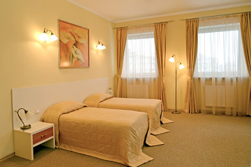  The classical bedroom with two beds in warm colors