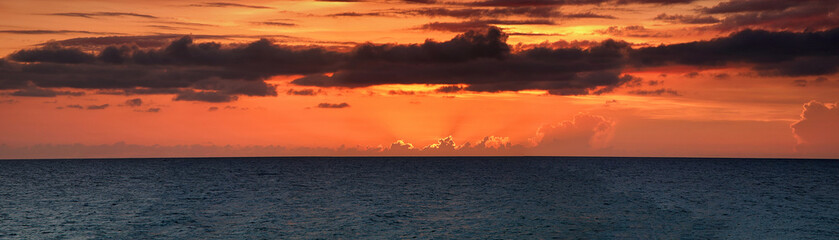 Fototapeta premium Panorama of a beautiful sunset on the Atlantic Ocean.