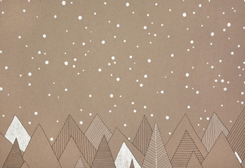 hand made illustration of snow falling over a forest, on natural, brown paper - 194236545