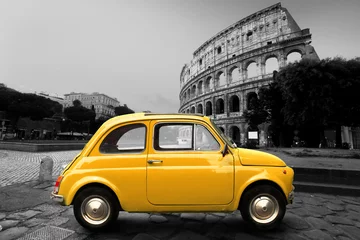 Poster Retro car on background of Colosseum in Rome Italy © Zarya Maxim