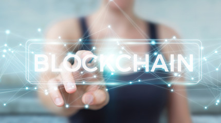 Businesswoman using blockchain cryptocurrency interface 3D rendering