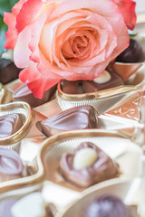 sweets and roses on wooden table for gift