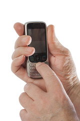Hands of old man with old mobile phone