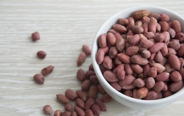 peanuts in a Cup scattered next to the table