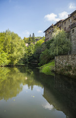 Fototapeta na wymiar Picturesque view of the houses and pond, Rupit