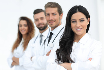woman doctor on the background of colleagues