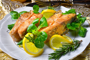 Fried carp fillet on wintry salad