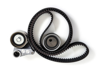 Naklejka premium Kit of timing belt with rollers on a white background isolated. Auto Parts. Spare parts.