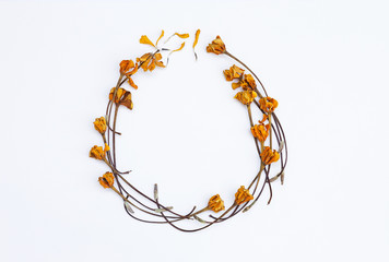 Dry yellow flower arrange in round shape frame, flower card background