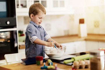 Adorable child making cookies