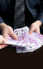 Human hands exchanging money - closeup shot