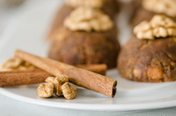 Traditional Turkish sweet dessert halva with walnut on the white plate.