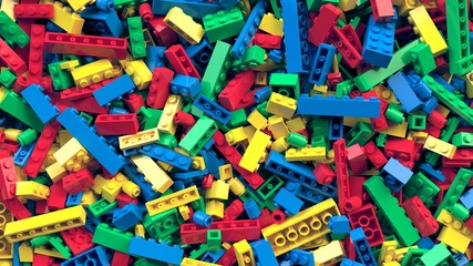 Lot of various colored toy bricks background