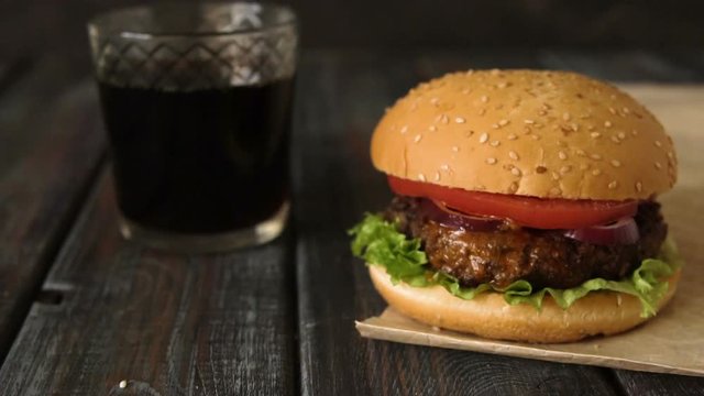Homemade grapefruit lemonade with ice in glass.