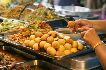 Thailand. Street market with food. Fish with spices