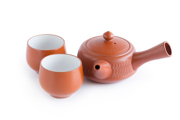 Japanese tea set. Ceramic teapot and a steaming cup Isolated on white background © kaiskynet