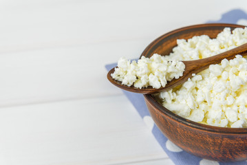 Cottage cheese with apples for breakfast in a bowl close up. Top view image. Cottage cheese with apples for breakfast in a bowl close up. Blue polka dot napkin. Top view image. Copyspace for your text
