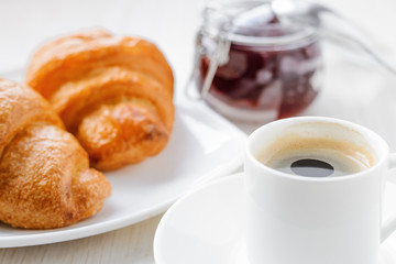 morning coffee with croissants on a wooden table. French Breakfast