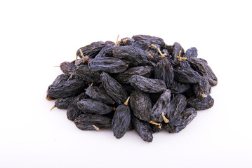 Dark raisins on a white background.
