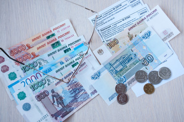Russian money, glasses and receipts for pension are on the table