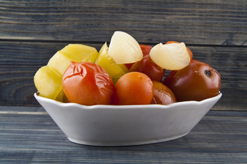 Tomatoes isolated on a wooden background