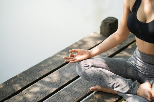 Young woman meditates while practicing yoga, Freedom concept, Calmness and relax, woman happiness. Toned picture