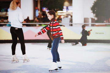 Cute teen girl learns to skate